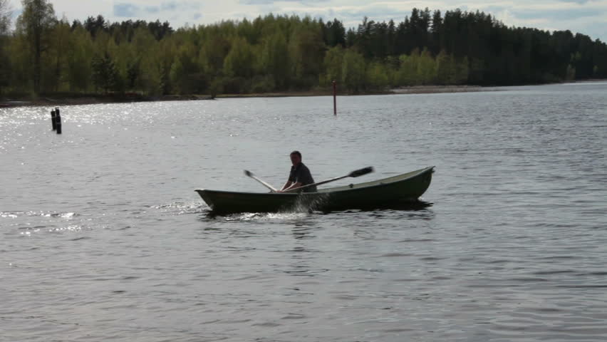 Rowing Boat Floats on the Lake