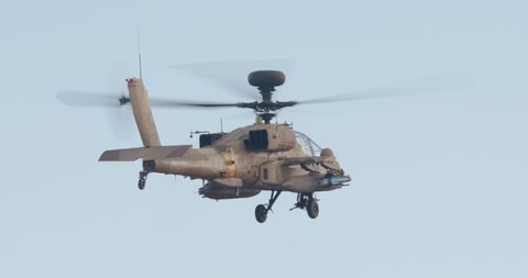Israeli air force Apache helicopter firing 30mm canon during attack
