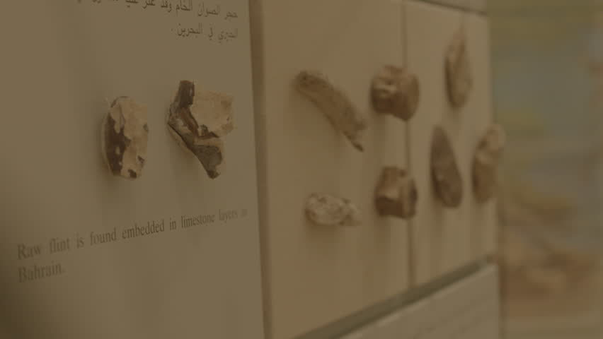 Manama, Bahrain - circa 2013 - Steadicam shot of stone age flint and bone tools and arrowheads in a display case at the Bahrain National Museum. Shot raw Arri Alexa.