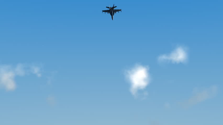 A F18 Hornet flies directly at the camera.   