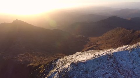 Panning aerial shot of Mount Snowdon, UK.