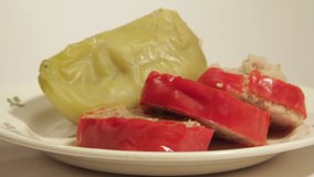 Sweet pepper stuffed with rice and minced meat. The video shows a dish, rotating slowly