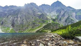Picturesque view of Black Lake below Mount Rysy (polish: Czarny Staw pod Rysami) in Tatra mountains, Poland. 1583m above sea level. Time Lapse