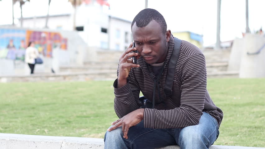 African American Male Making Phone Call in City.mov
