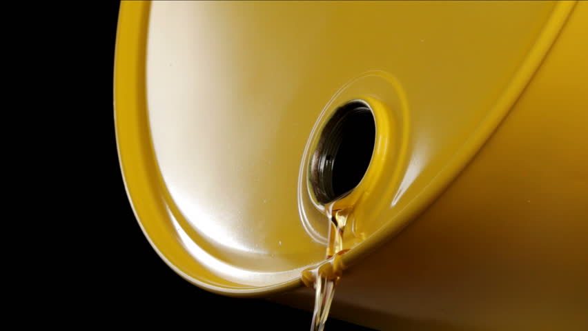 Oil drips out of yellow oil drum