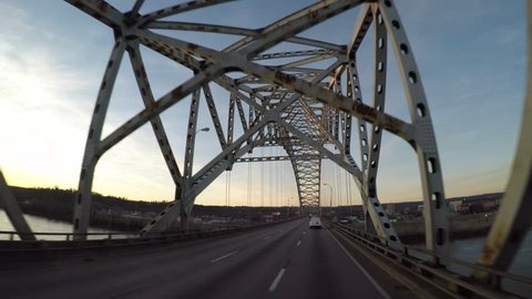 Elevated Driving POV across a bridge at the Kentucky / Illinois, USA border. | Jan. 2017