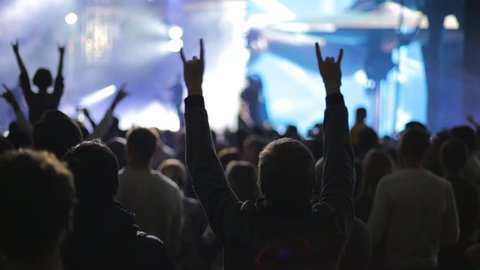 People partying at live music concert, slow-motion