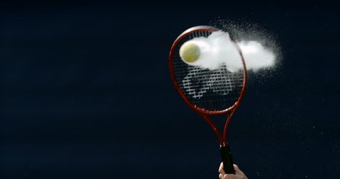 4K Close up in super slowmo, tennis ball suspended in mid air before being hit Dec 2016-UK