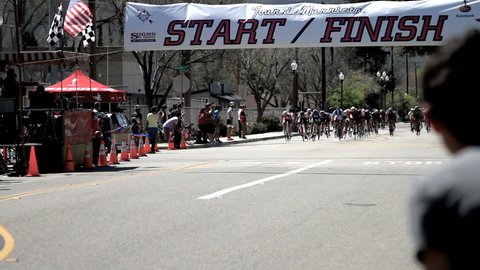 California - Circa 2009: A bike race in 2009. The winner crossing finish line in California. Editorial Stock Video