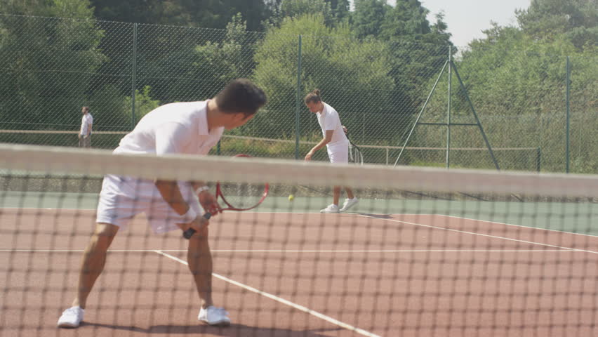 4k-male-doubles-tennis-players-stock-footage-video-100-royalty-free