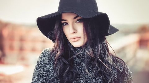 Cinemagraph seamless loop. Winter portrait of fashionable young woman looking at camera Video stock