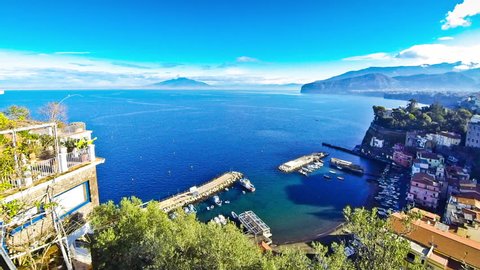 Picturesque morning view of Sorrento coastline and Gulf of Naples. Mount Vesuvius on the background. Time Lapse