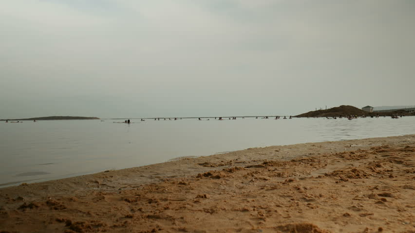 People bathing in the Dead Sea, famous place in Israel.