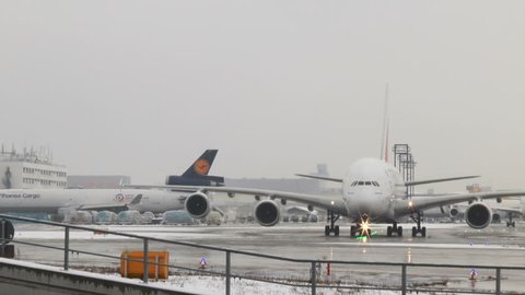 Frankfurt, Germany - January 10, 2017: An Airbus A380 of UAE airline Emirates is waiting for de-icing at Frankfurt Airport on a cold winter day