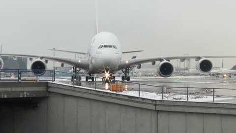 Frankfurt, Germany - January 10, 2017: An Airbus A380 of UAE airline Emirates is waiting for de-icing at Frankfurt Airport on a cold winter day