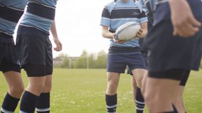4K Young team players in a scrum at rugby match Dec 2016-UK - Powered by Shutterstock - Get 15% off with code: PIKWIZARD15