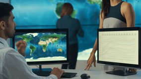 4K Business team in control room with large world map graphic on video wall Dec 2016-UK - Powered by Shutterstock - Get 15% off with code: PIKWIZARD15