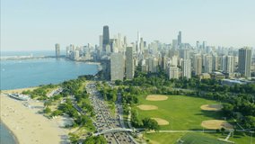 Aerial Chicago day view of Lake Michigan Lakeshore Drive vehicle traffic city beaches Waterfront golf course and Skyscraper buildings USA RED DRAGON - Powered by Shutterstock - Get 15% off with code: PIKWIZARD15