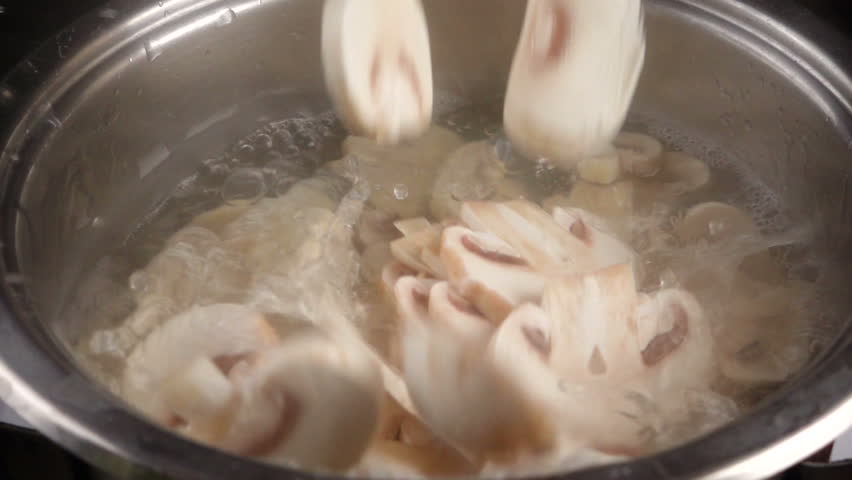 Falling of chopped mushrooms in metal pan with boiling soup, slow motion 250 fps - Powered by Shutterstock - Get 15% off with code: PIKWIZARD15