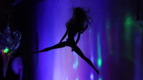 silhouette doll hanging and swaying from ceiling