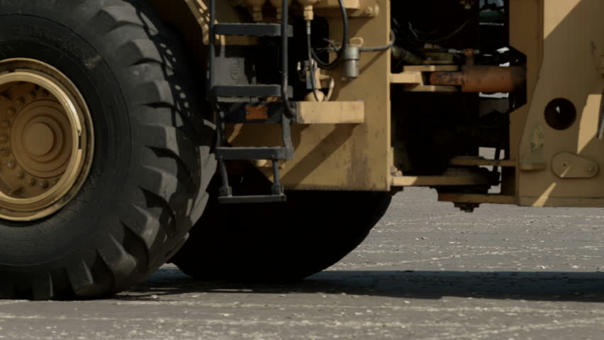 Close up shot on the wheels of a big loader