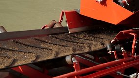 The sand is transported on a conveyor belt to be machined.
Detail. Videos about industry, assembly line, factory, manufacturing, sand, raw materials
