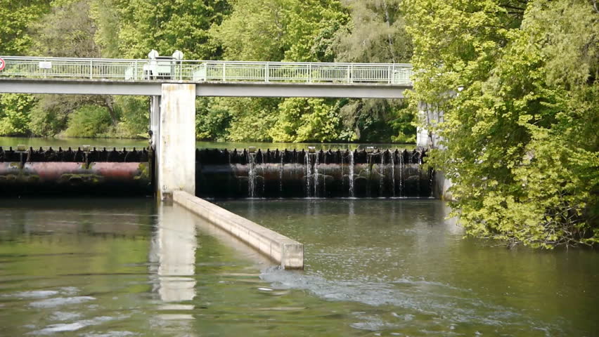 Water flowing through a river, passing a dam. Shot is taken in Esch-sur-Sure,
