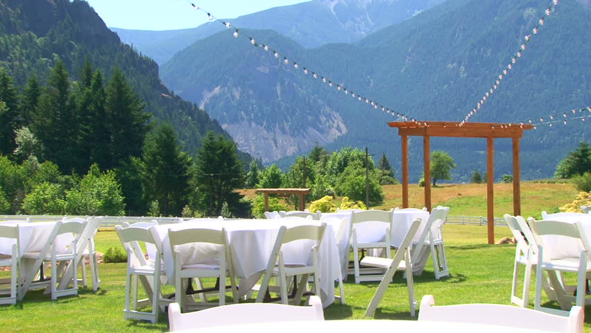 Outdoor wedding setting in Washington viewing altar and dinner tables.