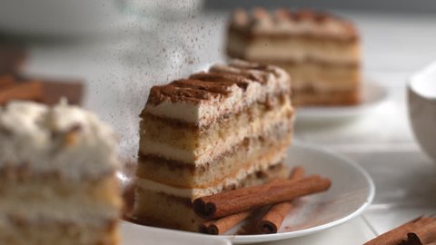 Cinnamon sprinkled onto Tiramisu cake in super slow motion, shot on Phantom Flex 4K