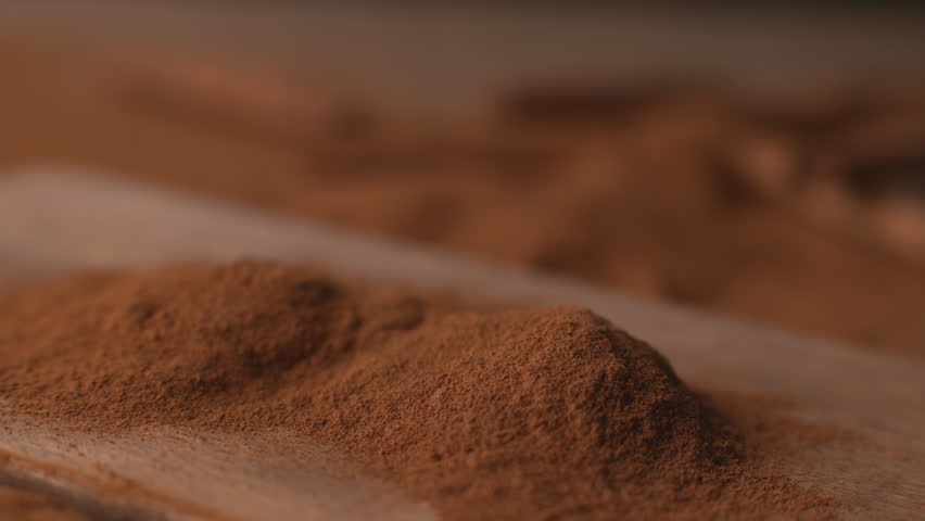 Cinnamon sticks falling into powdered cinnamon in super slow motion, shot on Phantom Flex 4K | Shutterstock HD Video #23013160