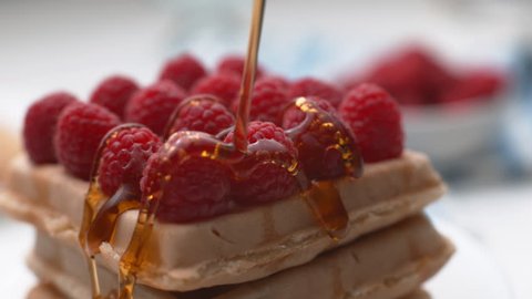 Pouring syrup onto waffles with berries in super slow motion, shot on Phantom Flex 4K
