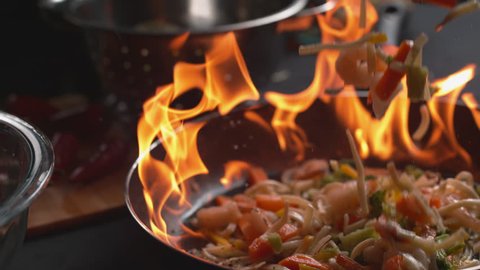 Stir fry into flaming pan in super slow motion, shot on Phantom Flex 4K