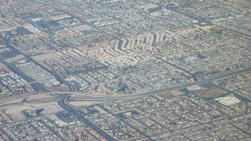 Flying in airplane over Las Vegas, Nevada and the urban expansion.