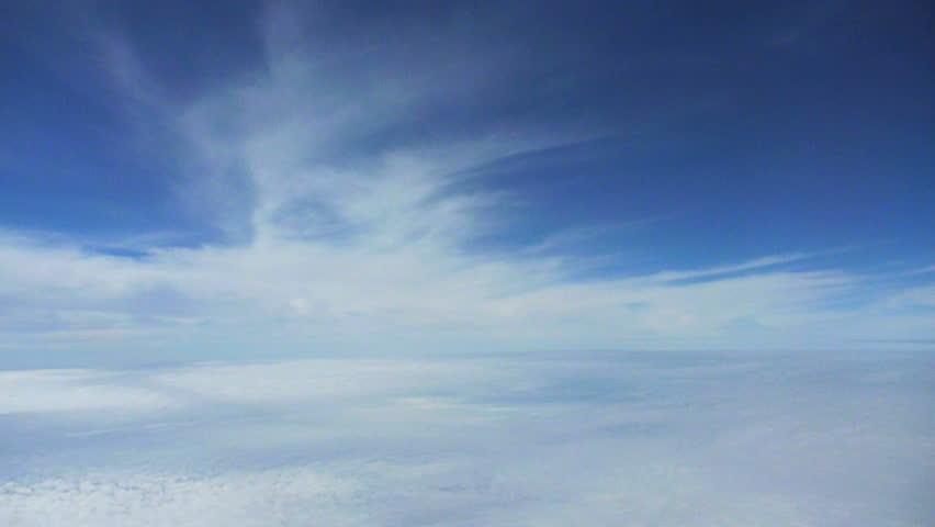 Flying in airplane through clouds.