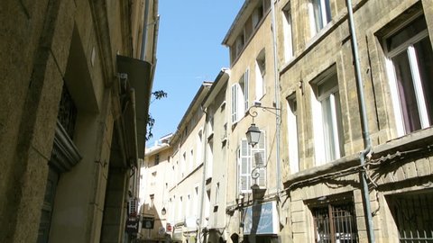 AIX-EN-PROVENCE, FRANCE - CIRCA 2015: Pan over old street in Aix en Provence with typical French architecture