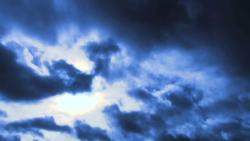 Person silhouetted raises hand into frame to give two thumbs up sign then walks out of frame.