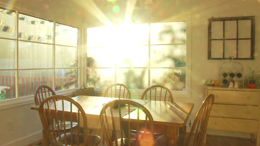 Bright sunset shines through window of dining room at house time lapse. Royalty-Free Stock Footage #2301548