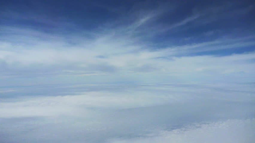 Flying in airplane through clouds.