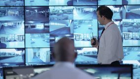 4K Surveillance team watching CCTV screens & reacting to suspicious activity Dec 2016-UK