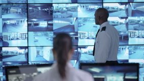 4K Surveillance team watching CCTV screens & reacting to suspicious activity Dec 2016-UK