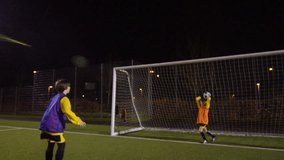 March 2016. British youth soccer team train on floodlit pitch at night Dec 2016-UK - Powered by Shutterstock - Get 15% off with code: PIKWIZARD15