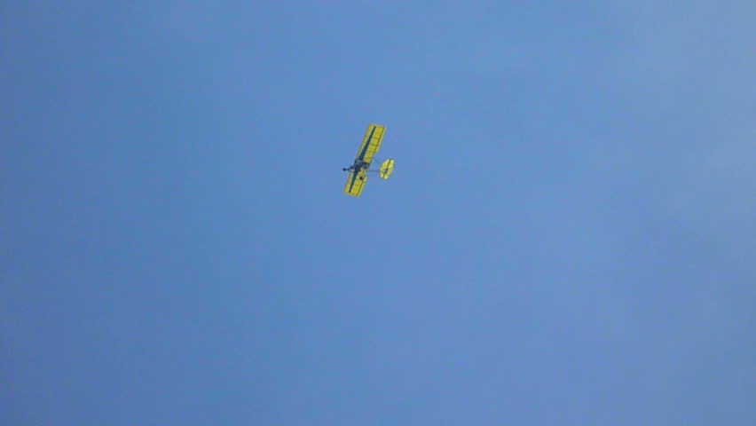 Hang glider flies high above Cabo San Lucas Resort on the beach.