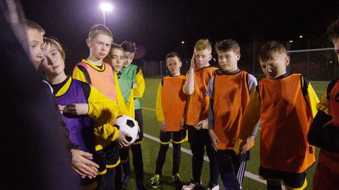 March 2016. British youth soccer team training huddle for a team talk Dec 2016-UK