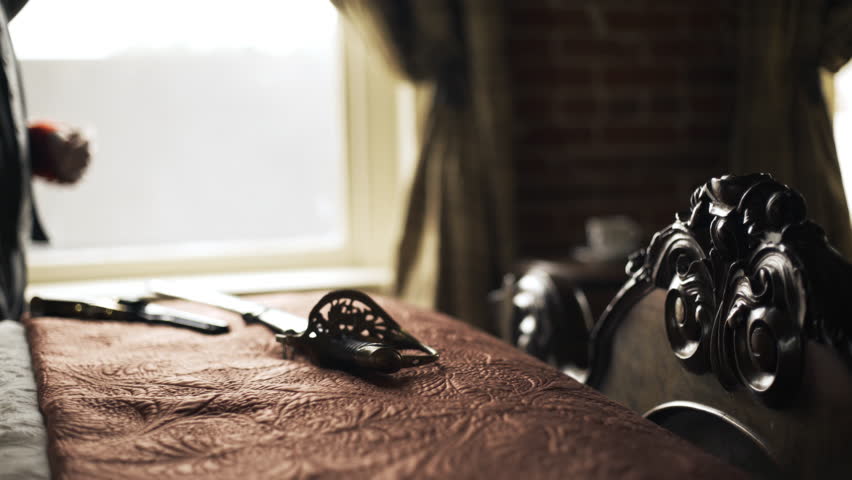 Confederate captain pacing in front of a window focus on hilt of saber on the bed4k