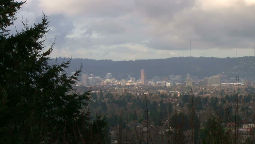 Downtown Portland Oregon establishing the city with camera zoom in on a