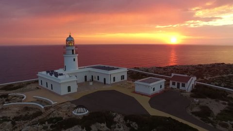 Stunning aerial shot of  lighthouse  in Menorca Island with beautiful sunrise.