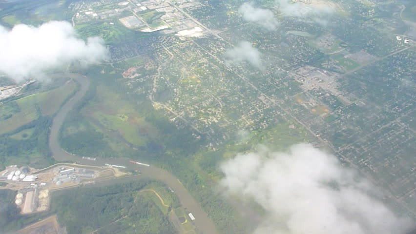 Flying in airplane through clouds over Portland, Oregon to Los Angeles,