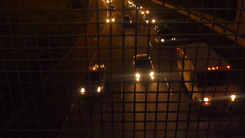 Rush hour traffic time lapse at night.