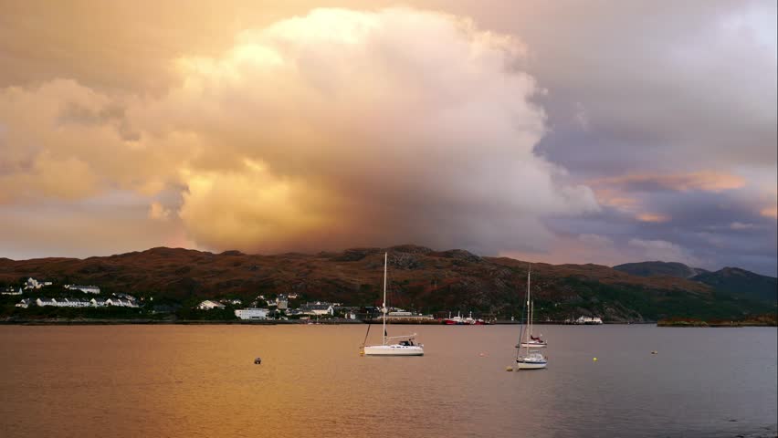 Timelapse of mall boats at Kyle Akin during sunset time in late summer, Kyle of Lochalsh, Isle of Skye, Highland Region, Scotland, United Kingdom (4k Timelapse)
