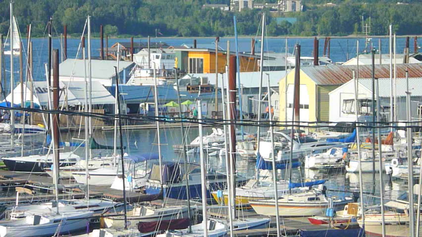 Camera zoom out on Portland, Oregon marina on the Colombia River.